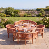 Teak Set 150cm Maximus Round Table 4cm Top (2 San Francisco Benches, 2 San Francisco Chairs) Cushions included- Premium Teak Garden Furniture Set - UK and Ireland garden setting - image 1 Teak Set 150cm Maximus Round Table 4cm Top (2 San Francisco Benches, 2 San Francisco Chairs) Cushions included- Premium Teak Garden Furniture Set - UK and Ireland garden setting - image 1