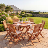 Teak 120cm Round Sunshine Folding Table 4cm Top (6 Folding Chairs) Cushions Included - Premium Teak Garden Furniture Set - UK and Ireland garden setting - image 5 Teak 120cm Round Sunshine Folding Table 4cm Top (6 Folding Chairs) Cushions Included - Premium Teak Garden Furniture Set - UK and Ireland garden setting - image 5