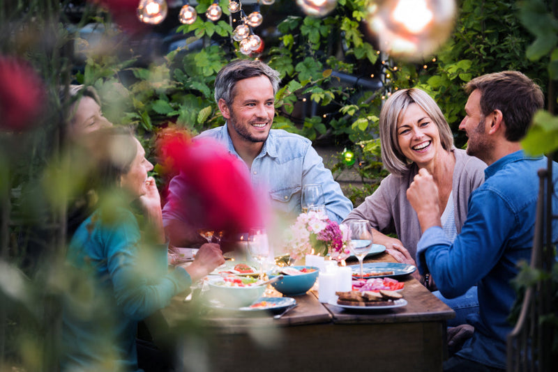 People using Teak Outdoor garden furniture for Dinning